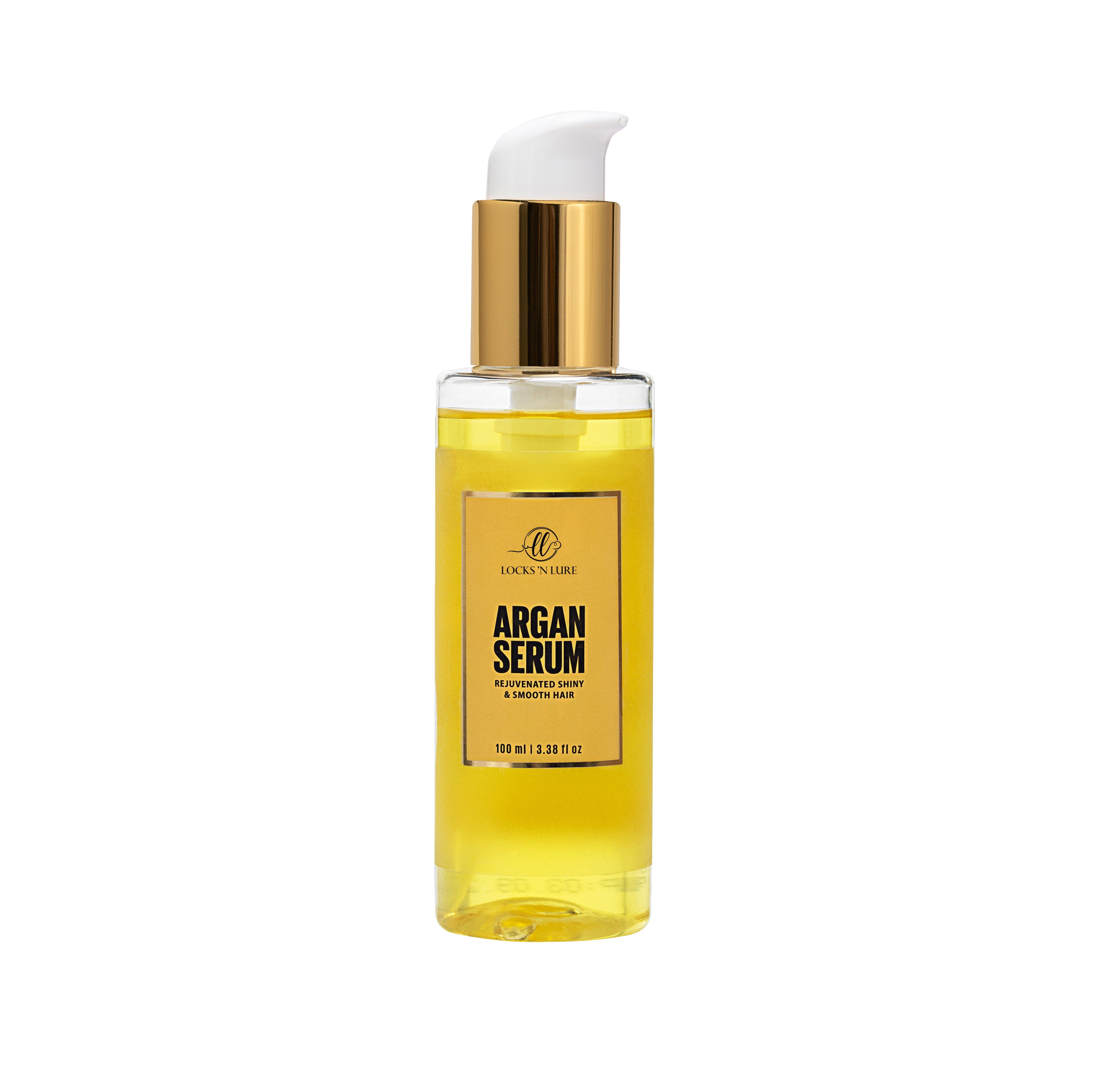 Bottle of argan serum with gold cap on a white background