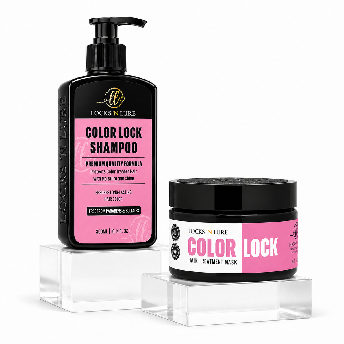 A hair care set from Locks 'N Lure, featuring a black pump bottle of Color Lock Shampoo and a black jar of Color Lock Hair Treatment Mask, both with pink labels, displayed on clear acrylic blocks against a white background.