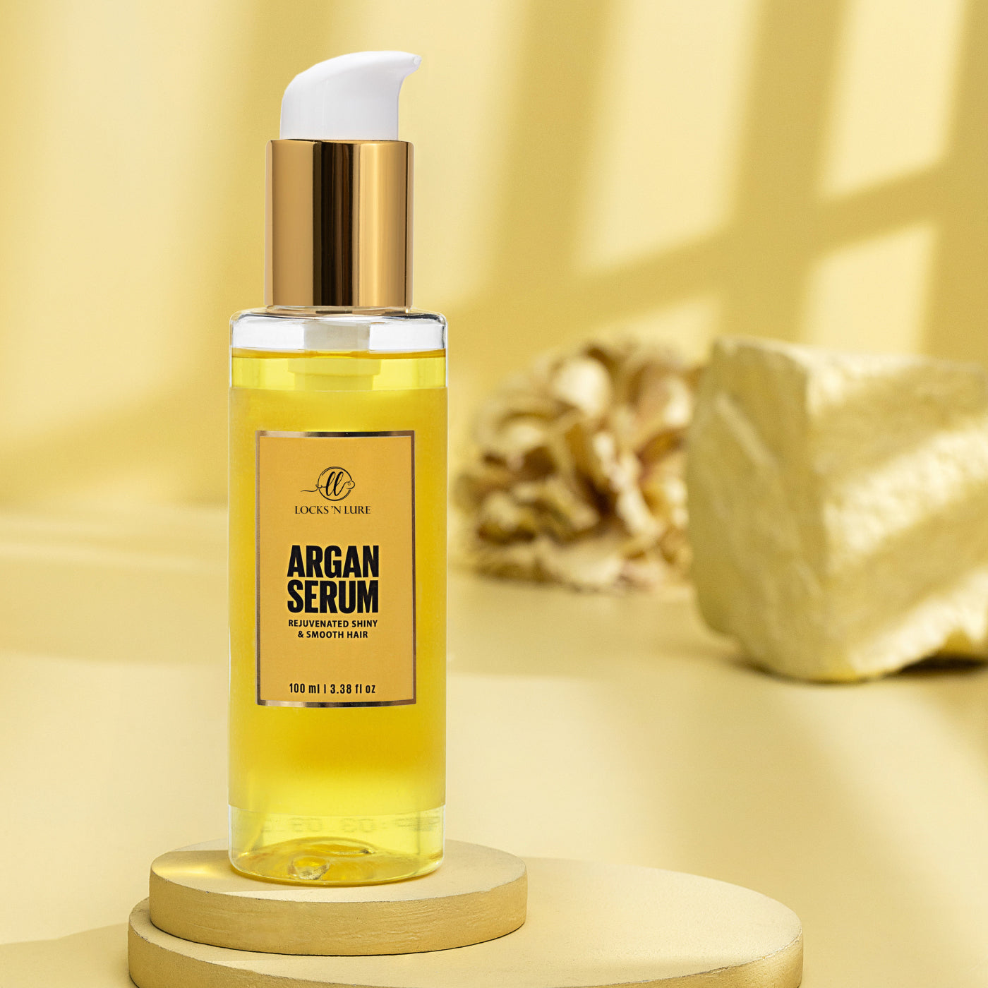 Argan serum bottle on a yellow background